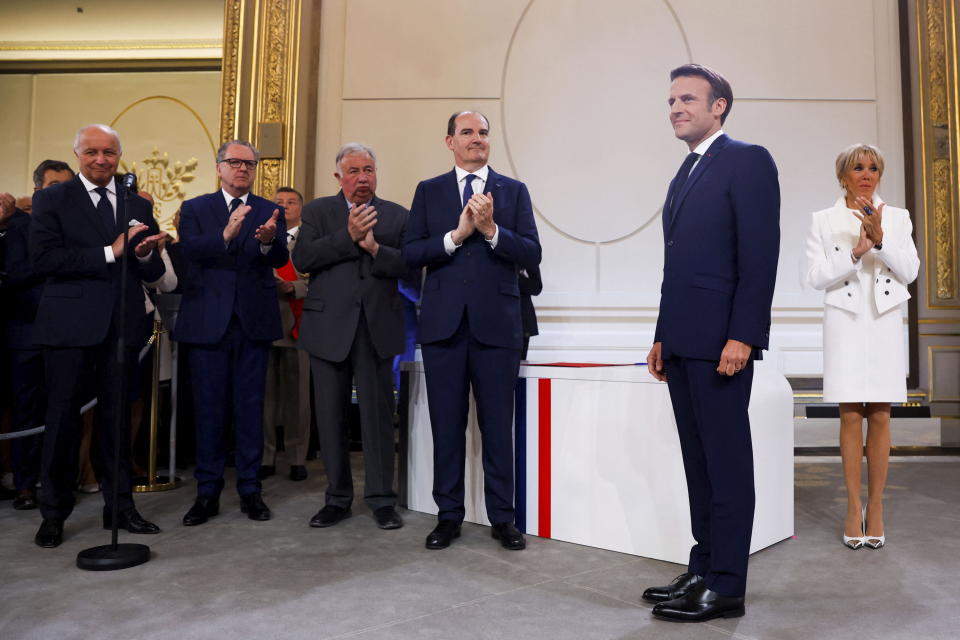 French President Emmanuel Macron satnds during the ceremony of his inauguration for a second term at the Elysee palace, in Paris, France, Saturday, May 7, 2022. Macron was reelected for five years on April 24 in an election runoff that saw him won over far-right rival Marine Le Pen. (Gonzalo Fuentes/Pool via AP)