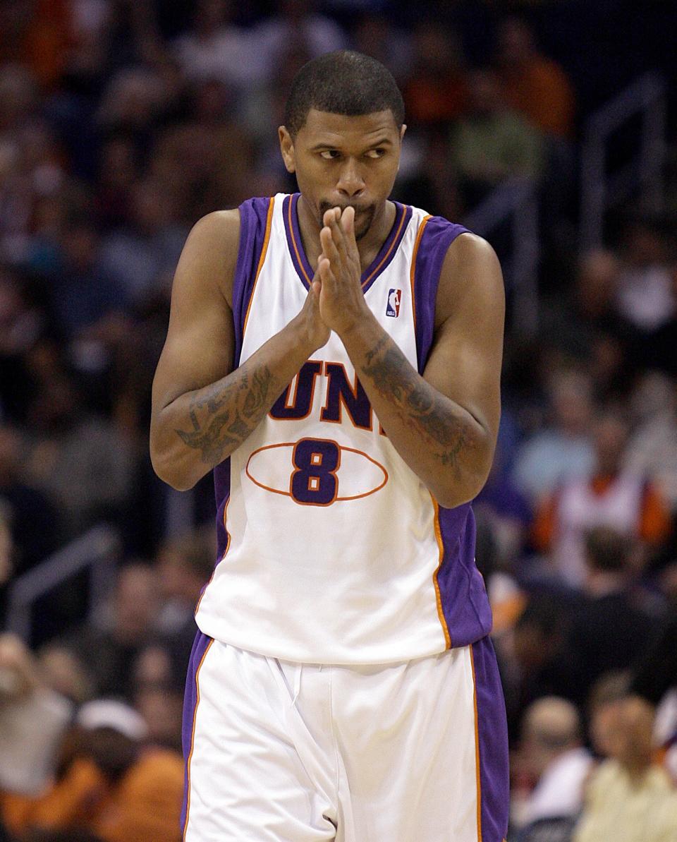 Newly-aquired Phoenix Suns guard Jalen Rose eyes the Memphis Grizzlies bench as he enters the game in the first quarter of a basketball game Saturday, Nov. 11, 2006, in Phoenix. (AP Photo/Paul Connors).