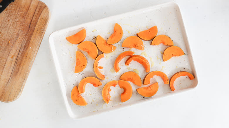 squash tossed in olive oil on baking tray