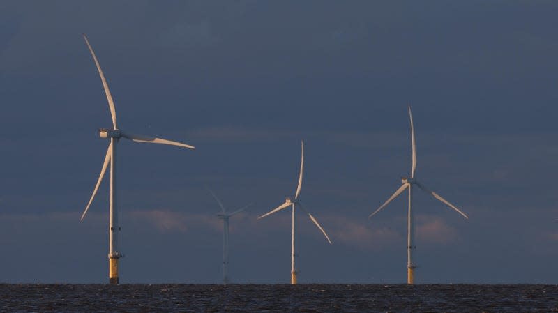 Photo of three offshore wind turbines