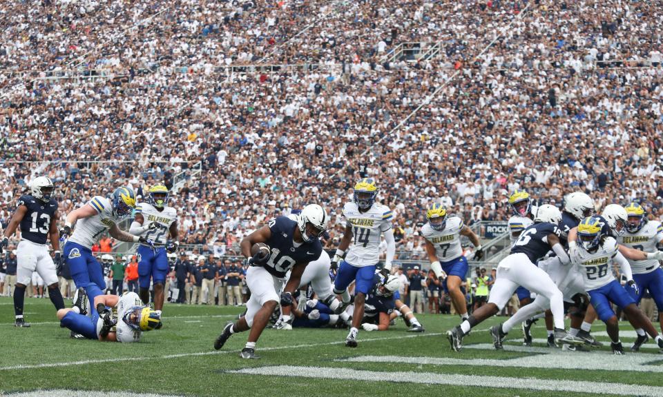 Penn State's Nicholas Singleton (10) gets a rushing touchdown in the first quarter at Beaver Stadium to open the scoring against Delaware, Saturday, Sept. 9, 2023 in University Park, Pa.