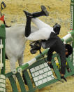 Ukrainian Pavlo Timoshchenko falls during the men's riding event at the final of the Modern Pentathlon World Championships in Moscow on 11 September.