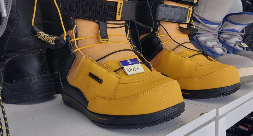 A pair of yellow snowboard boots for sale at a Vinnies secondhand store in Australia, where charity shops have come under criticism for overcharging. 