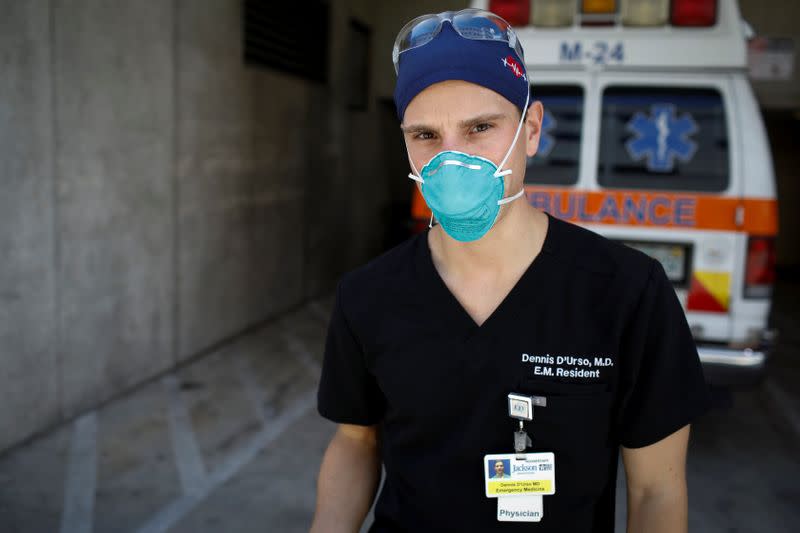 Dennis D'Urso, a resident ER doctor at Jackson Memorial Hospital, poses for a photo during his shift amid an outbreak of the coronavirus disease (COVID-19), in Miami