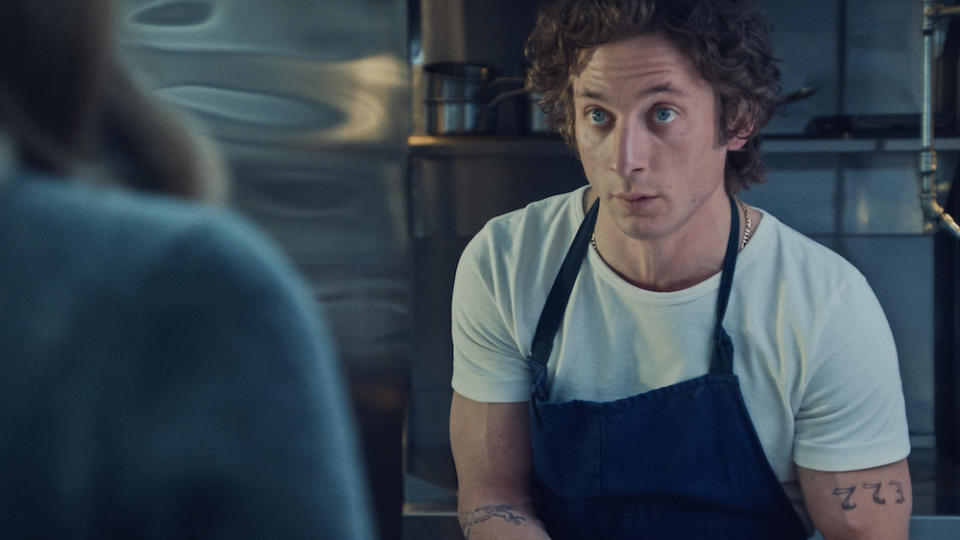 'The Bear' Season 3 stars Jeremy Allen White as Carmy, shown here wearing an apron in the kitchen