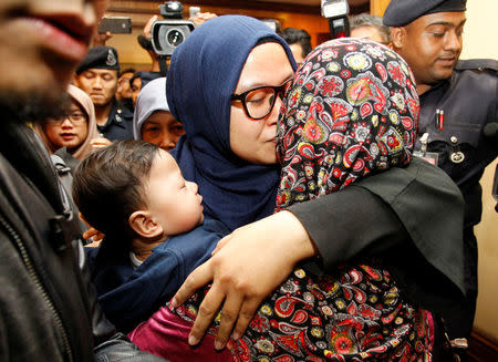 Saadah Jamaludin, one of the nine Malaysians who were previously stranded in Pyongyang hugs a family member as she returns home from Pyongyang, at the Kuala Lumpur International Airport in Sepang, Malaysia. REUTERS/Lai Seng Sin