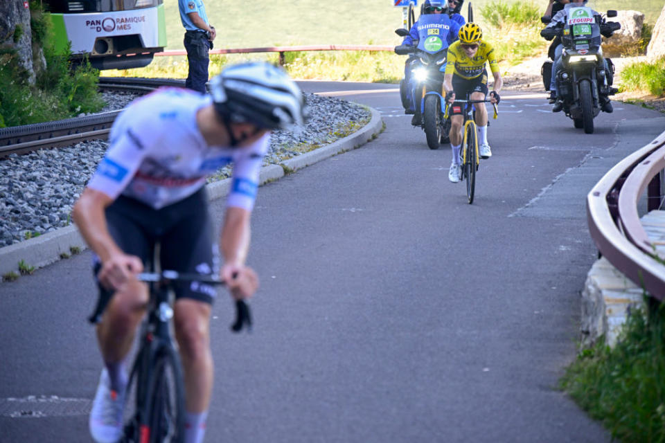 PUY DE DME FRANCE  JULY 09 LR Tadej Pogacar of Slovenia and UAE Team Emirates  White Best Young Rider Jersey attacks to Jonas Vingegaard of Denmark and Team JumboVisma  Yellow Leader Jersey during the stage nine of the 110th Tour de France 2023 a 1824km stage from SaintLonarddeNoblat to Puy de Dme 1412m  UCIWT  on July 09 2023 in Puy de Dme France Photo by Bernard Papon  PoolGetty Images