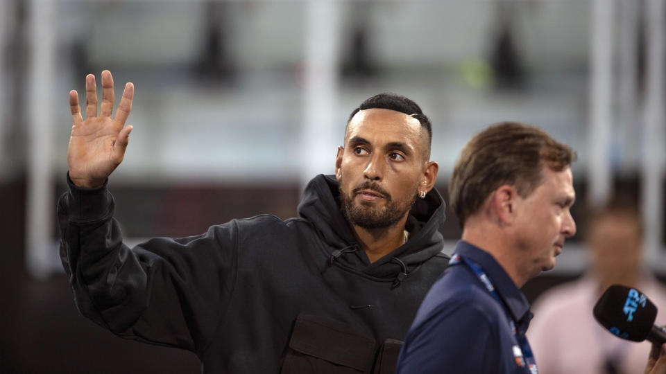 Nick Kyrgios waves to fans as he withdrew from the singles draw at the Atlanta Open Tennis tournament due to a knee injury Tuesday, July 26, 2022, in Atlanta. (AP Photo/Hakim Wright Sr.)