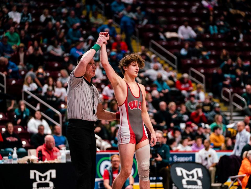 West Allegheny's Ty Watters has his arm raised after becoming a state champion in March of 2022. Watters' state title was the first in West Allegheny school history.