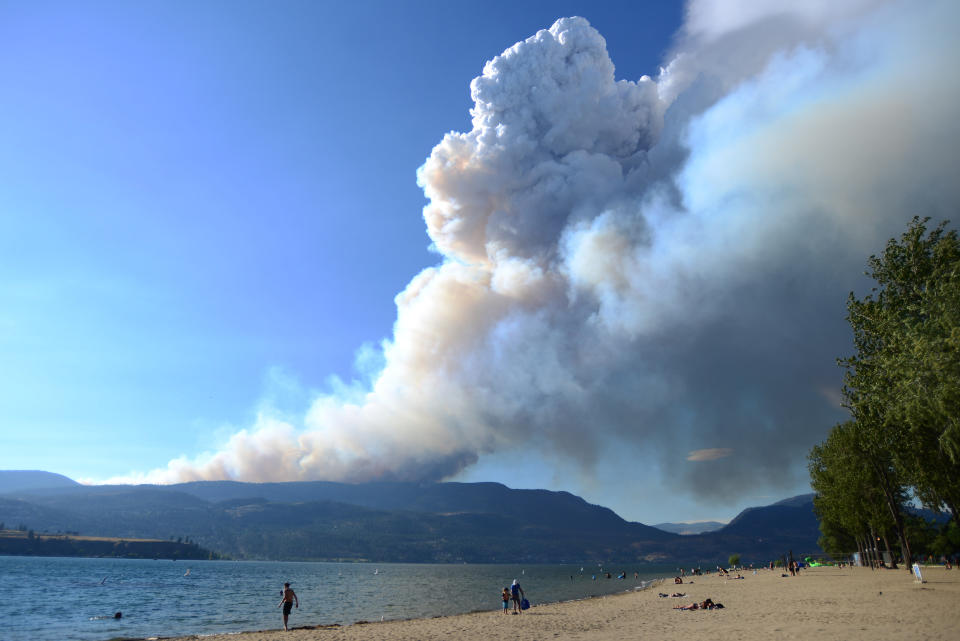 Smoke from the McDougall Creek fire is seen over Okanagan Lake from Kelowna, B.C., on Thursday, Aug. 17, 2023. THE CANADIAN PRESS/Joe O'Connal