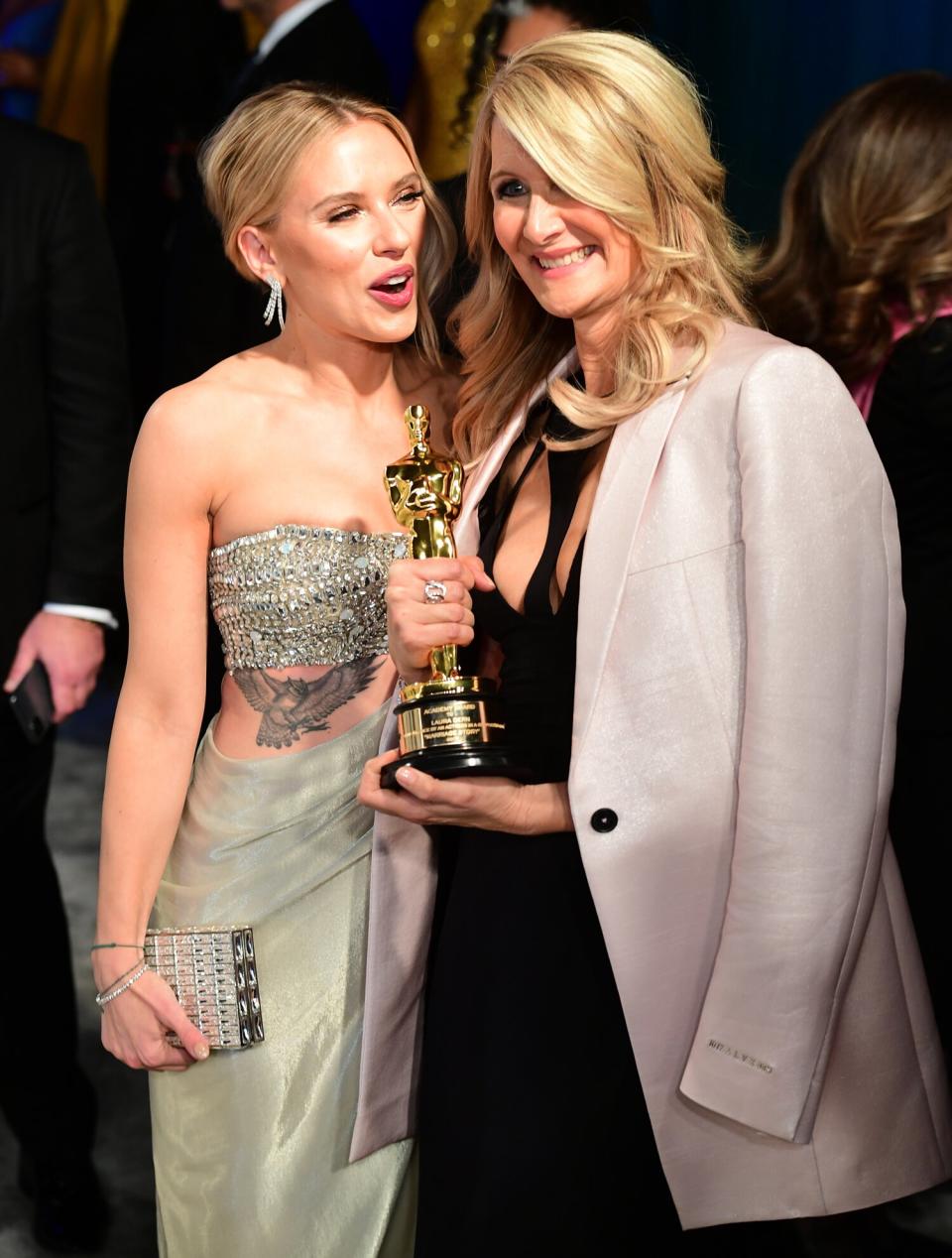 Scarlett Johansson chats with Best Supporting Actress winner, Laura Dern, at the Vanithy Fair Oscar Party.