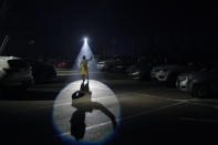 Anderson de Souza, the clown Batatinha, performs at the Estoril Circus in a drive-in format, amid the new coronavirus pandemic in Itaguai, greater Rio de Janeiro, Brazil, Saturday, July 18, 2020. "The pandemic is a reality for all of us. After 4 months closed it's a great emotion to perform in this drive-in format", says the 36-year-old artist. Following the measures to curb the spread of the COVID-19, artists of this circus have decided to go back to work in a different way, as circus drive-in. (AP Photo/Leo Correa)