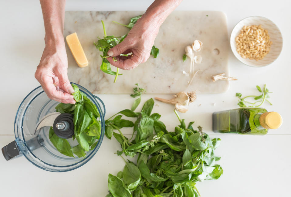 Making pesto in a food processor