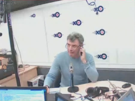 Russian opposition politician Boris Nemtsov speaks on his mobile phone before giving an interview to radio station Ekho Moskvy, hours before he was shot in Moscow in this still image from an Ekho Moskvy video on February 27, 2015. REUTERS/Ekho Moskvy via Reuters TV