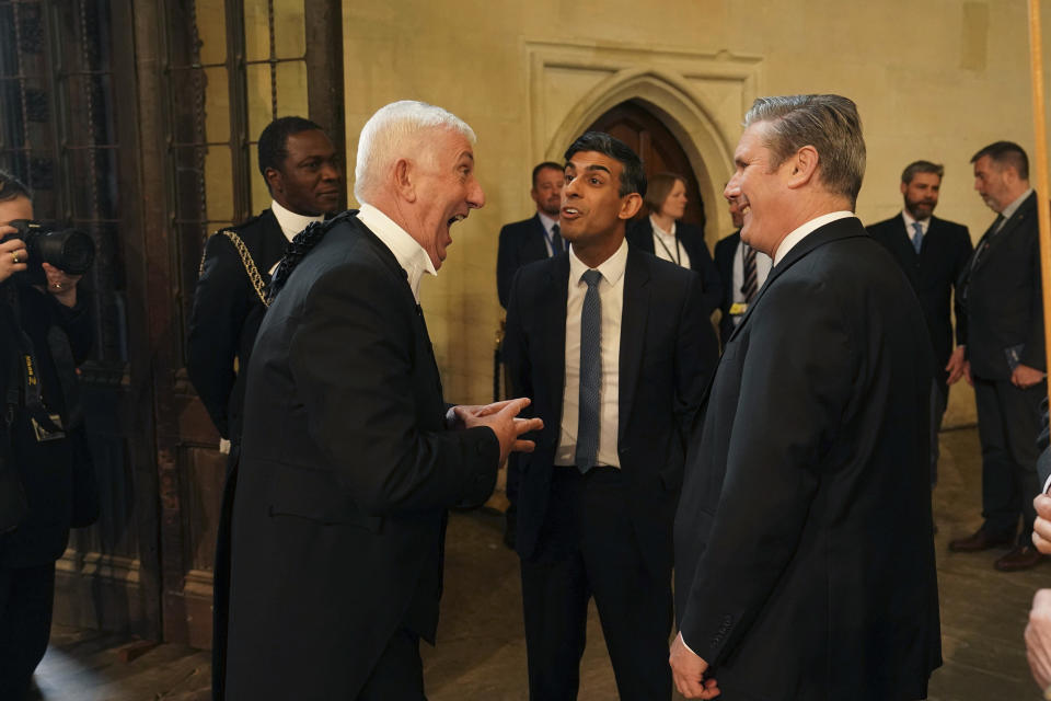 From left, Speaker of the House of Commons, Sir Lindsay Hoyle, Prime Minister Rishi Sunak and Labour leader Keir Starmer, gather ahead of a visit by King Charles III and the Queen Consort to Westminster Hall, at the Palace of Westminster to attend a reception ahead of the coronation, in London, Tuesday May 2, 2023. (Arthur Edwards/Pool Photo via AP)