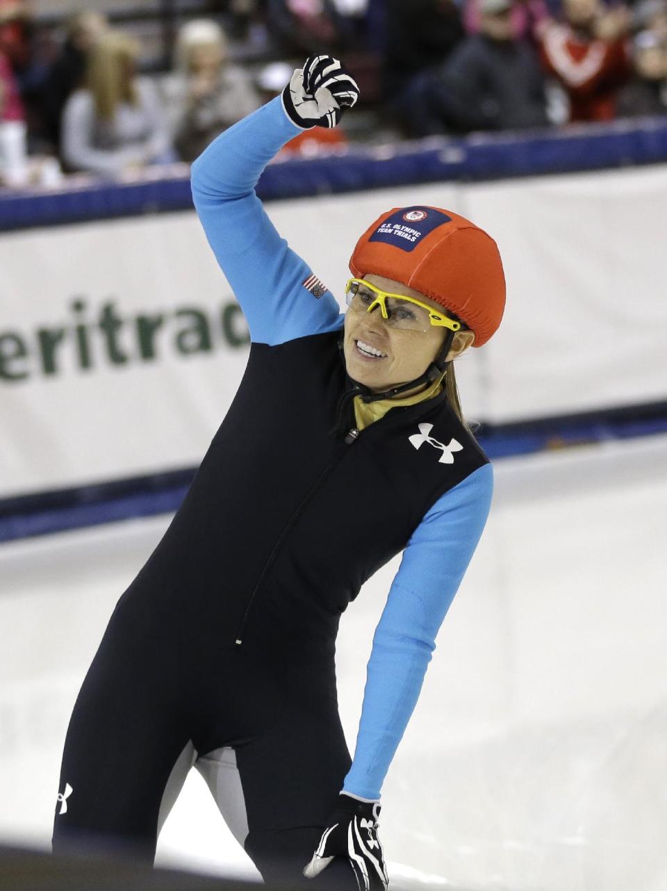 First-place finisher Jessica Smith reacts to the crowd after winning the women's 1,500 meters during the U.S. Olympic short track speedskating trials, Friday, Jan. 3, 2014, in Kearns, Utah. (AP Photo/Rick Bowmer)