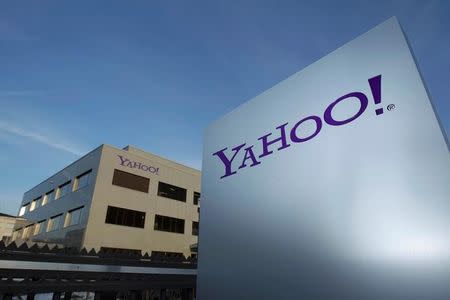 A Yahoo logo is pictured in front of a building in Rolle, 30 km (19 miles) east of Geneva, December 12, 2012. REUTERS/Denis Balibouse/Files