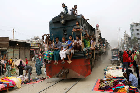 FILE PHOTO: Passengers travel on an overcrowded train in Dhaka, Bangladesh, October 8, 2018. REUTERS/Mohammad Ponir Hossain/File Photo