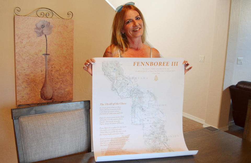 Sacha Johnston of Albuquerque holds up a poster from&nbsp;Fennboree,&nbsp;an annual gathering of Forrest Fenn treasure hunters. (Photo: Chris D'Angelo/HuffPost)