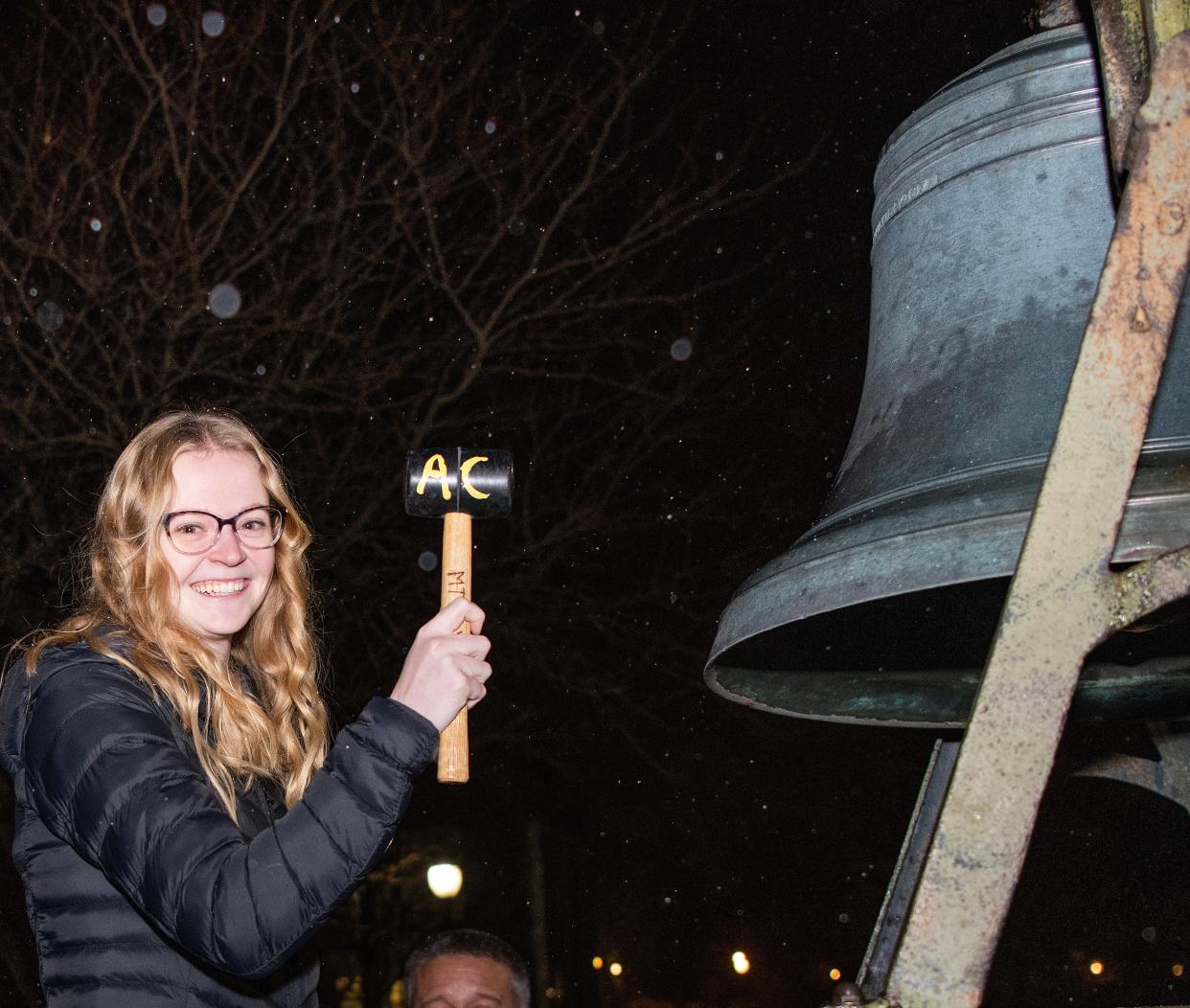 Jordan Cooper, an elementary integrated science student at Adrian College, takes part Nov. 16, 2022, in the college's inaugural Victory Bell ringing ceremony, which celebrated 10 teacher education students who successfully passed the State of Michigan MTTC test, also known as the Michigan Tests for Teacher Certification.