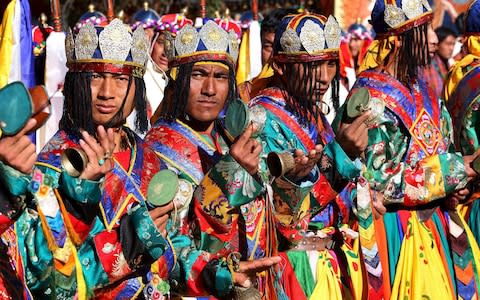 Musicians await Bhutan's fifth king during his coronation - Credit: Harish Tyagi/EPA