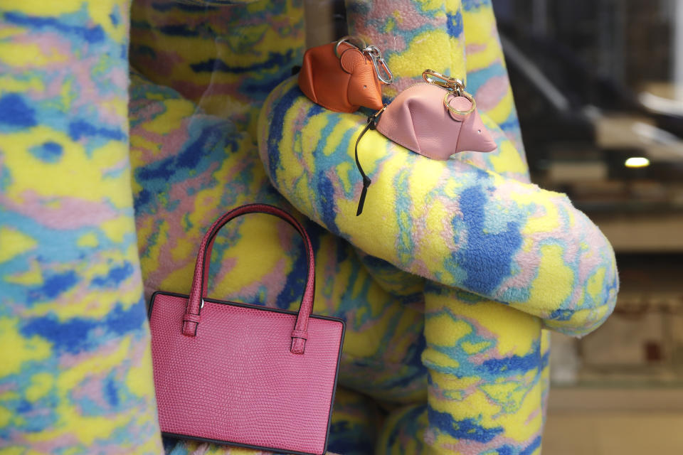 Leather handbags are displayed in a shop at Montenapoleone shopping district, in Milan, Italy, Tuesday, Feb. 4, 2020. China's virus outbreak is giving global business a chill. In Milan’s luxury Montenapoleone shopping district, dozens of luxury brands decked out their windows for Chinese New Year. But wealthy Chinese shoppers, who are responsible for about one-third of all luxury purchases globally, have failed to arrive in their usual numbers. (AP Photo/Luca Bruno)