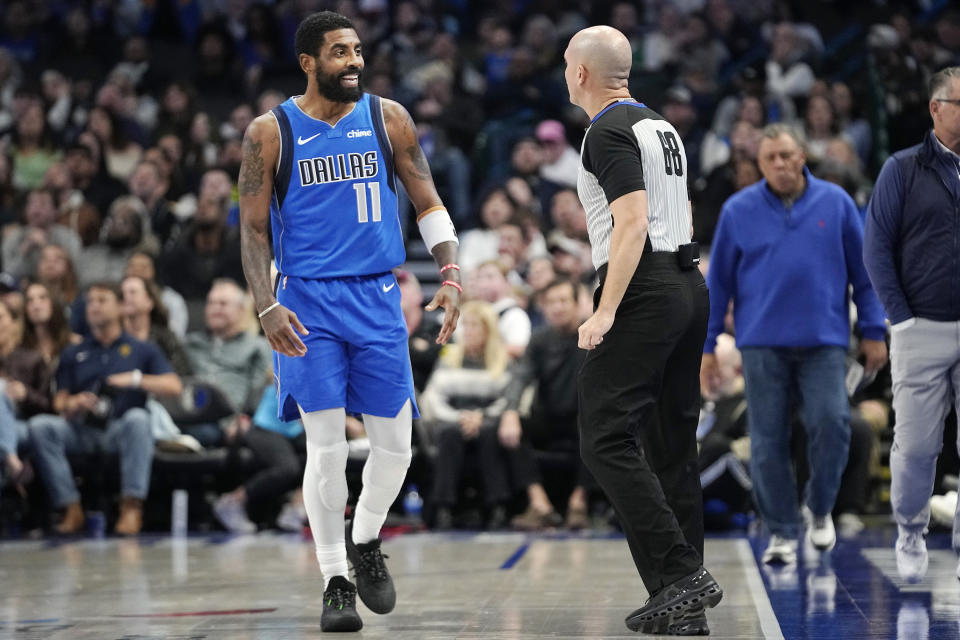 Dallas Mavericks guard Kyrie Irving (11) questions a call by referee Jacyn Goble (68) during the second half of an NBA basketball game against the Portland Trail Blazers in Dallas, Friday, Jan. 5, 2024. (AP Photo/LM Otero)