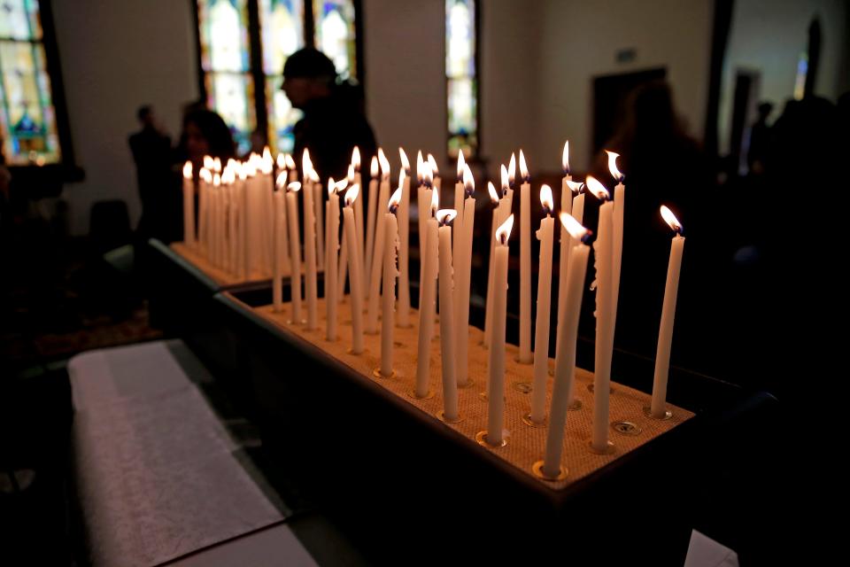 Candles representing people that died the previous year while experiencing homelessness are lit during a 2023 Homeless Persons Memorial at Eighth Street Church of the Nazarene in Oklahoma City.
