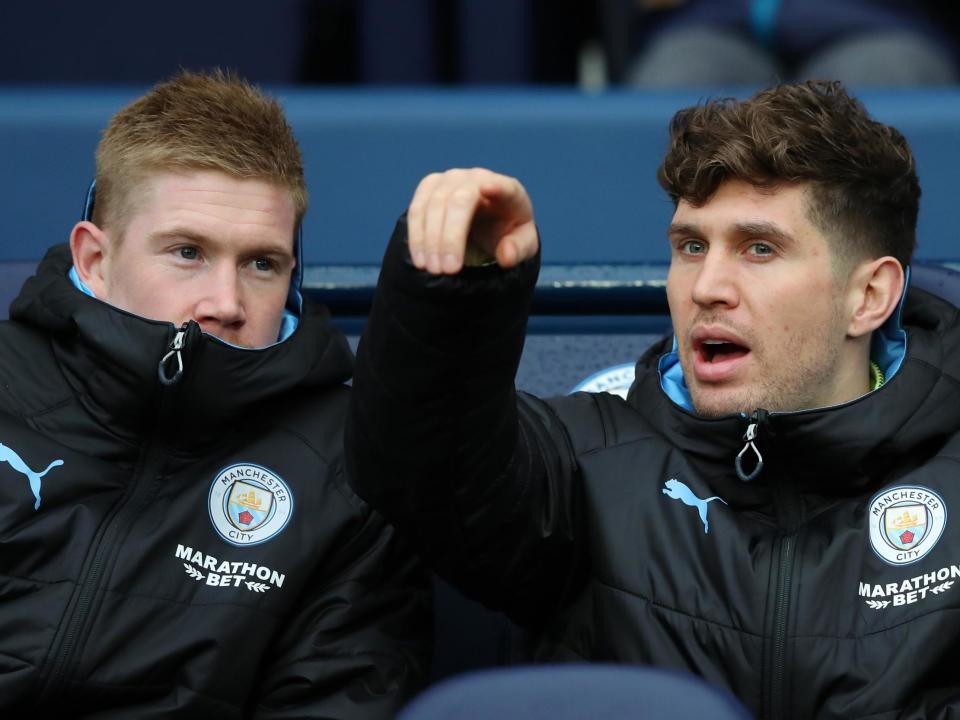 Manchester City defender John Stones (right) with Kevin De Bruyne: Getty Images