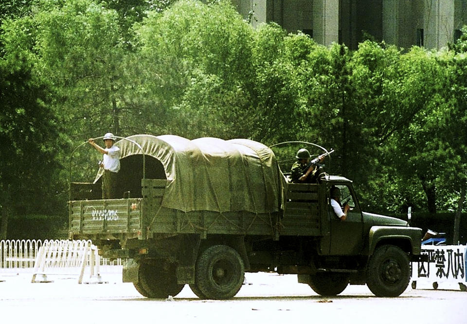 In this June 7, 1989 photo, Chinese troops patrol the street after the Chinese army fought its way into Tiananmen Square the night of June 3-4 to reclaim the square from student-led demonstrators who had been protesting for democratic reforms for three weeks. (AP Photo/Terril Jones)