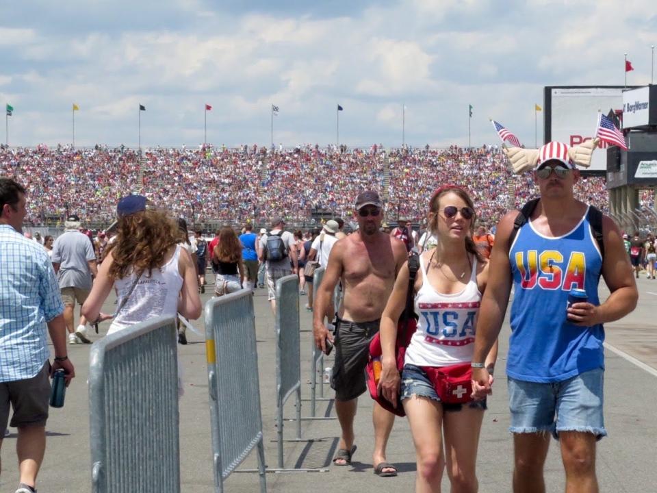 People make their way through the infield of Indianapolis Motor Speedway during the Indianapolis 500 in 2016.