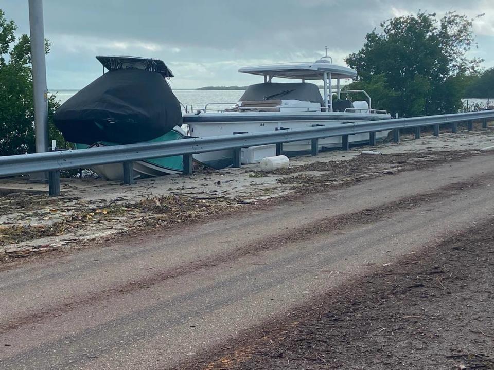 Boats that unmoored from a nearby marina are stuck on the shoulder of the 18 Mile Stretch of U.S. 1 in Key Largo Thursday, Nov. 16, 2023.