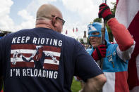 <p>A man dressed as Captain America speaks to a demonstrator during the pro-Trump ‘Mother of All Rallies’ held on the National Mall in Washington on Sept. 16, 2017. (Photo: Zach Gibson/AFP/Getty Images) </p>