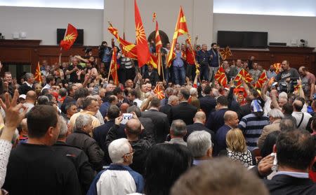 Protesters entered Macedonia's parliament after the governing Social Democrats and ethnic Albanian parties voted to elect an Albanian as parliament speaker in Skopje. Macedonia April 27, 2017. REUTERS/Ognen Teofilovski