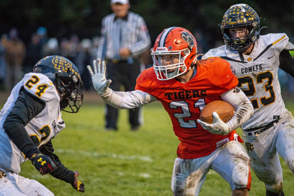 Byron's Chandler Binkley pushes off Reed-Custer's Josh Bohac on Byron's touchdown drive at the end of the fourth quarter of the state quarterfinal game against Reed-Custer in Byron on Saturday, Nov. 13, 2021. Byron won 28-24.