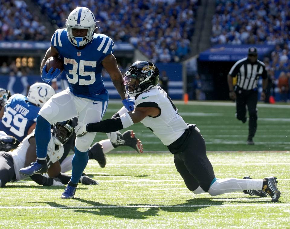 Indianapolis Colts running back Deon Jackson (35) works to move past Jacksonville Jaguars safety Andre Cisco (5) on Sunday, Oct. 16, 2022, during a game against the Jacksonville Jaguars at Lucas Oil Stadium in Indianapolis.