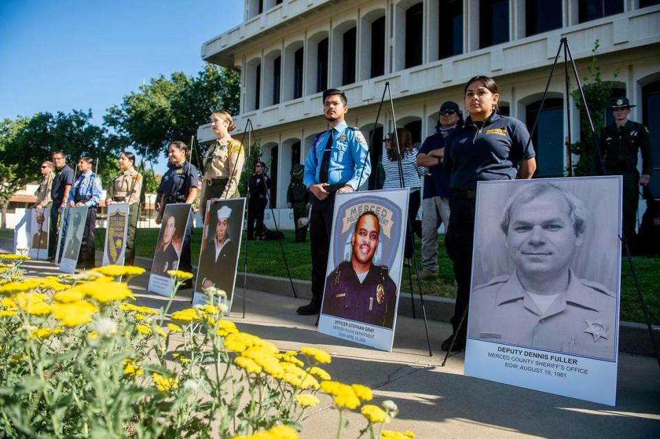 Images of Merced County peace officers killed in the line of duty are displayed during the annual Merced County Peace Officers Memorial ceremony in Merced, Calif., on Wednesday, May 18, 2022.