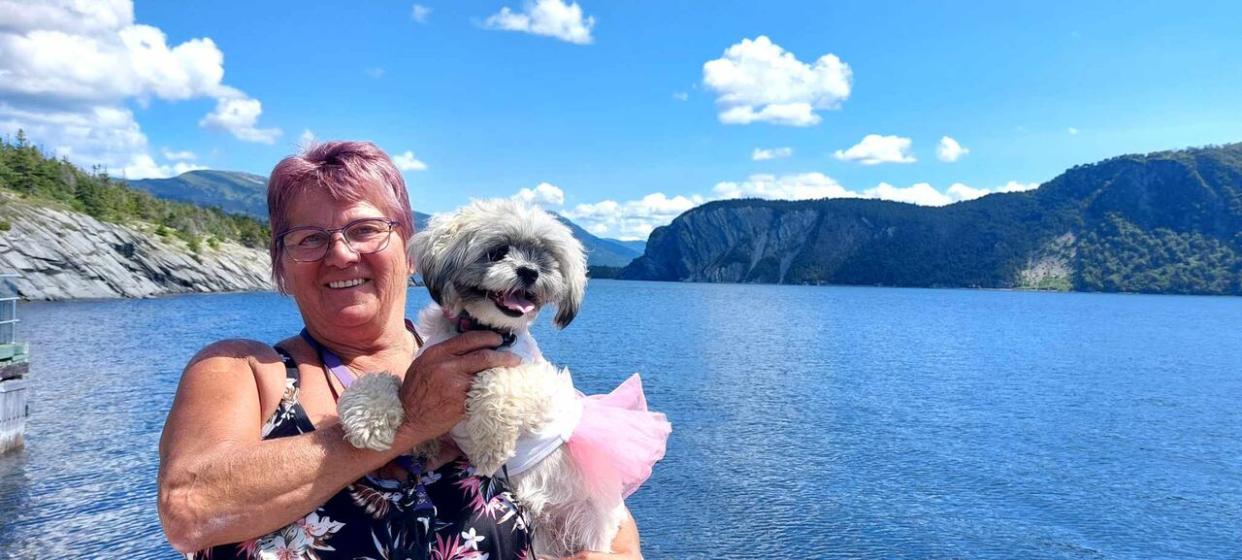 Auburtine and her dog enjoy the sights of what she called the trip of a lifetime in western Newfoundland.  (Submitted by Alice Auburtine - image credit)