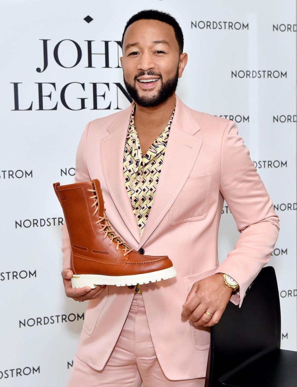 <p>John Legend gets all dressed up on Sept. 20 to celebrate the launch of his Sperry x John Legend Collection at Nordstrom at The Grove in L.A.</p>