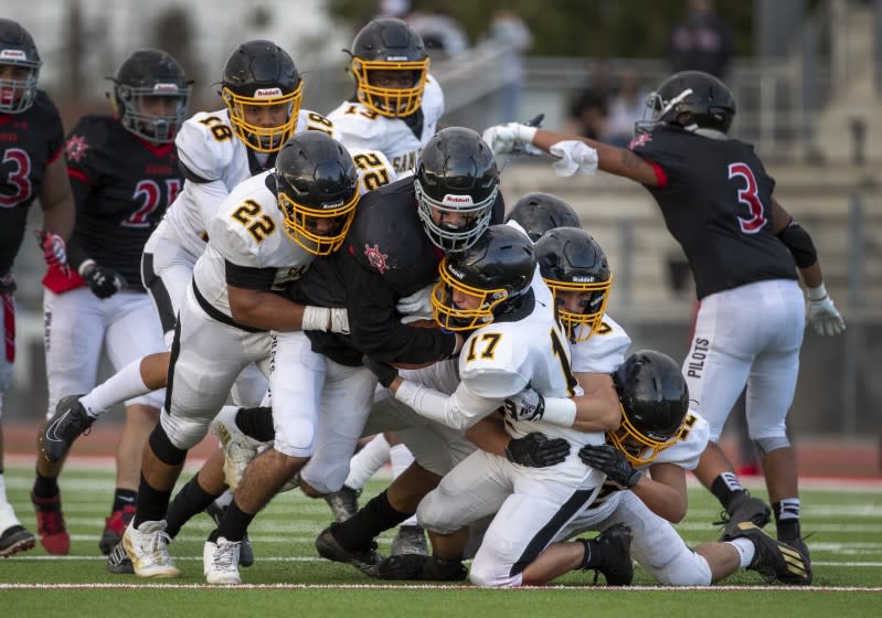 WILMINGTON, CA - APRIL 23, 2021: San Pedro defensive lineman Isaiah Howard (22) and San Pedro linebacker Kain Perris.