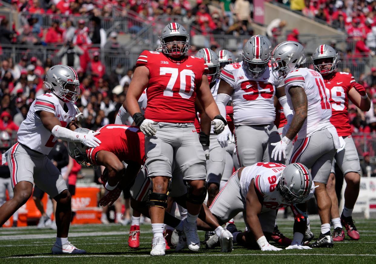 April 13, 2024; Columbus, Ohio, USA; 
Ohio State Buckeyes offensive lineman Josh Fryar (70) competes during the first half of the LifeSports spring football game at Ohio Stadium on Saturday.