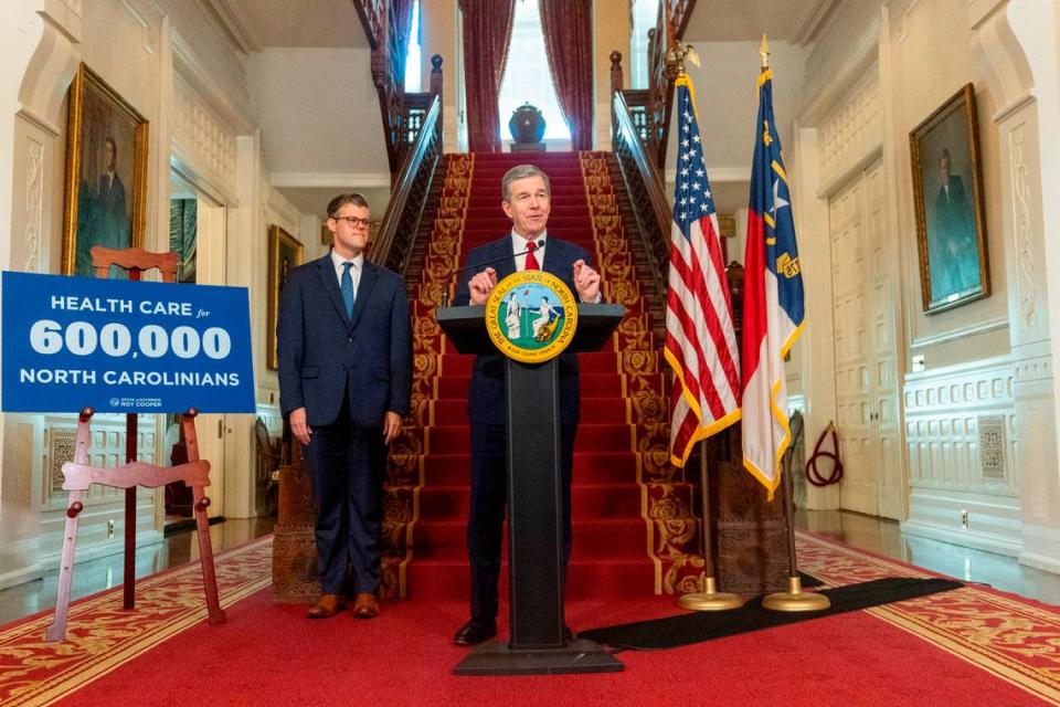 Gov. Roy Cooper announces a Medicaid expansion launch date of Dec. 1 as Secretary of Health and Human Services Kody Kinsley looks on during a press conference Monday, Sept 25, 2023 at the Executive Mansion in Raleigh.