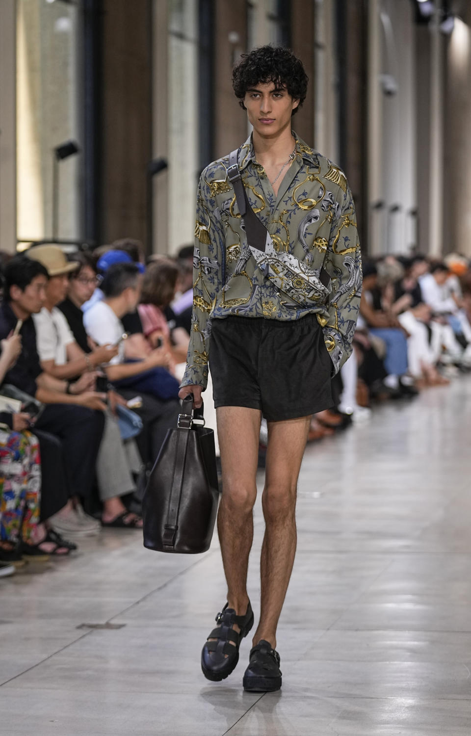 A model wears a creation for the Hermes Menswear Spring/Summer 2024 fashion collection presented in Paris, Saturday, June 24, 2023. (AP Photo/Michel Euler)