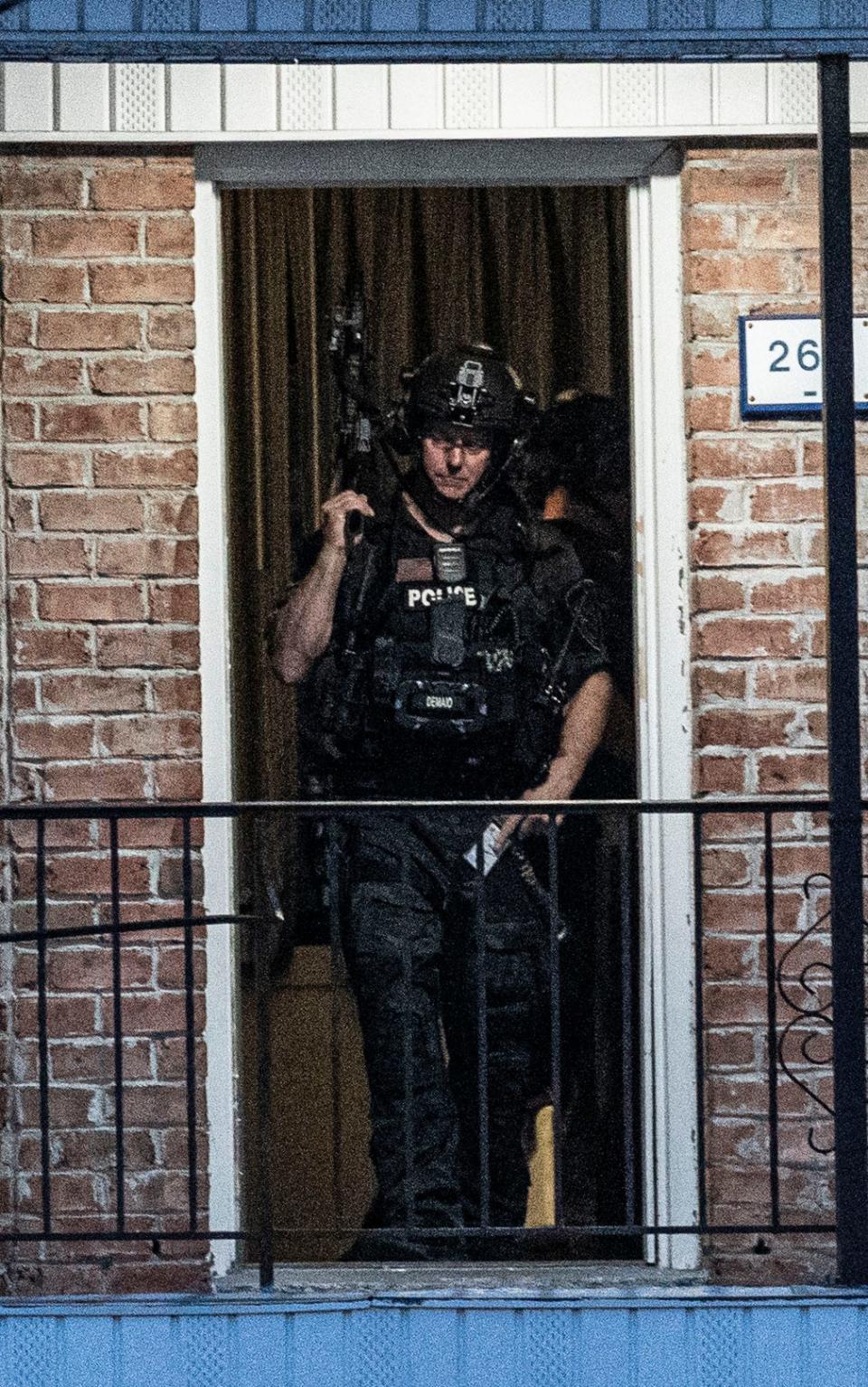 Heavily armed police stand on the second floor of the Days Inn Motel in Elmsford April 14, 2024 where a man was barricaded in a room. The situation began at around 4:00 pm and ended after 9:00 pm.