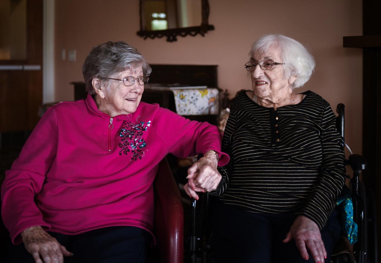 "We might as well be sisters, Mary Beth DeSante, 100,  left, says about, Michelina DeRose, 99, Tuesday, April 18, 2023, at Fairview Adult Foster Care in Grand Ledge. DeRose will become a centenarian in June. "She's Italian and I married an Italian and we both lived in the same neighborhood," DeSante says. "Michelina was a teacher. She never married or had children, but I tell her all those students she taught were her children."