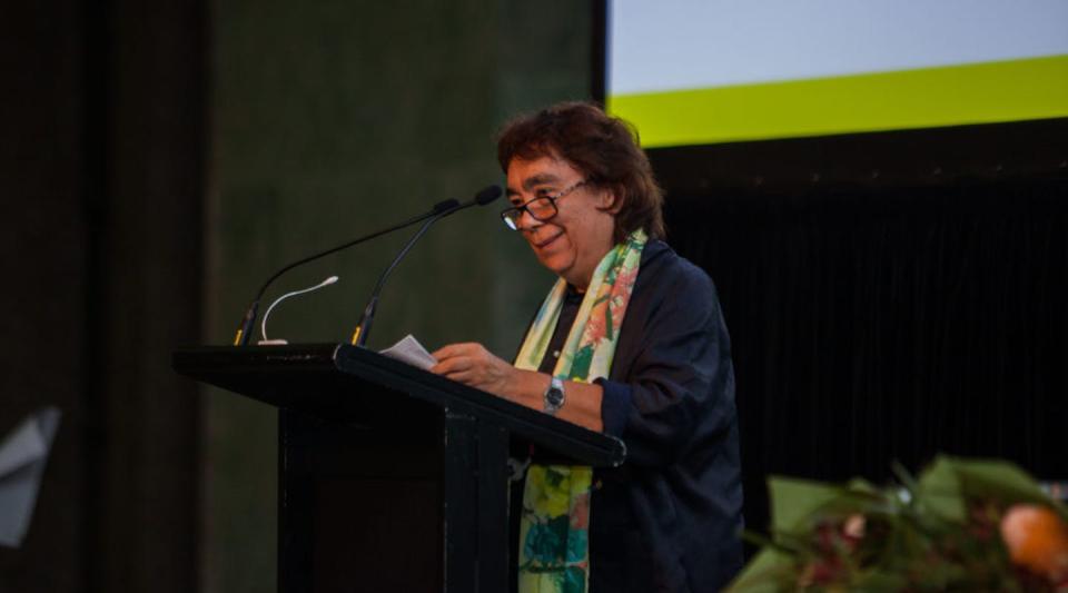 woman speaking at podium