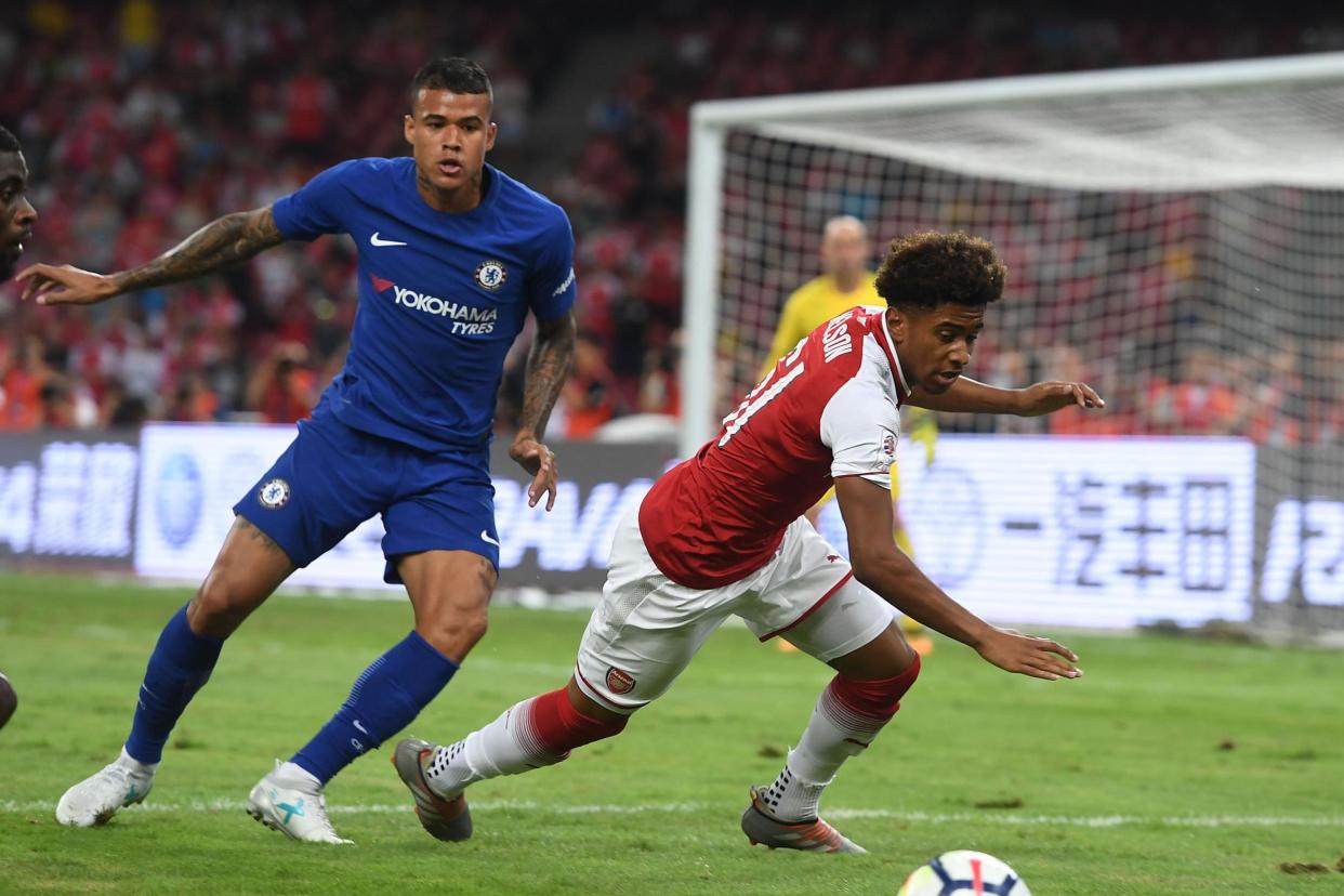 Kenedy (left) was booed by supporters at the Bird's Nest Stadium: Arsenal FC via Getty Images