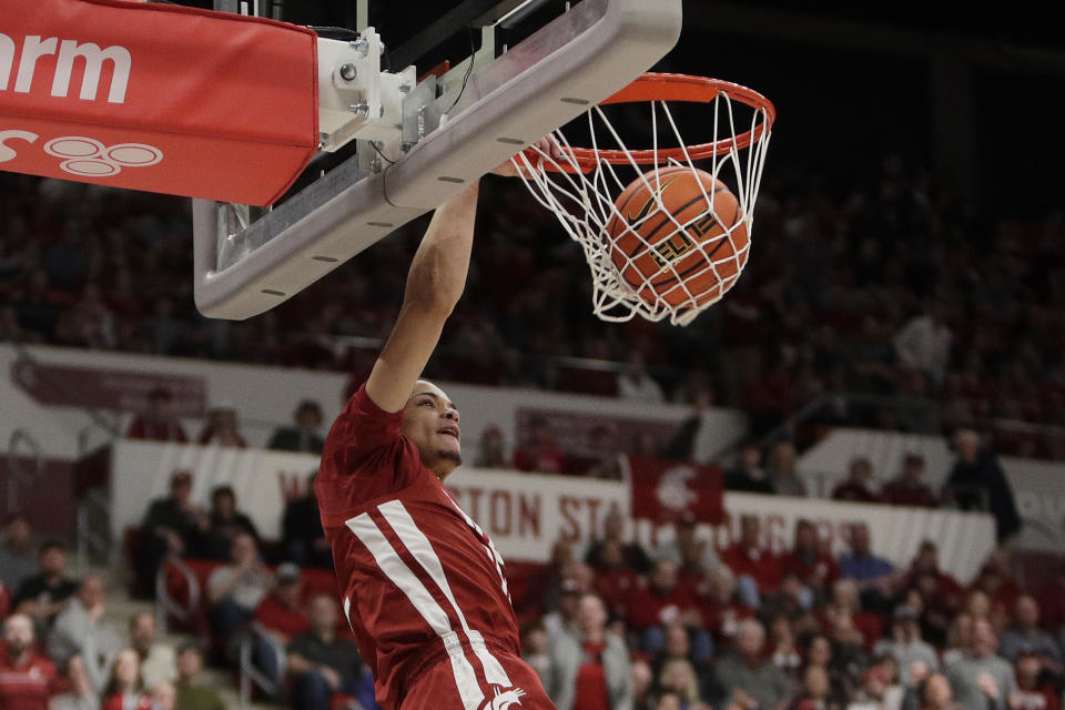 Washington State guard Isaiah Watts dunks during the first half of an NCAA college basketball game against Washington, Thursday, March 7, 2024, in Pullman, Wash. (AP Photo/Young Kwak)