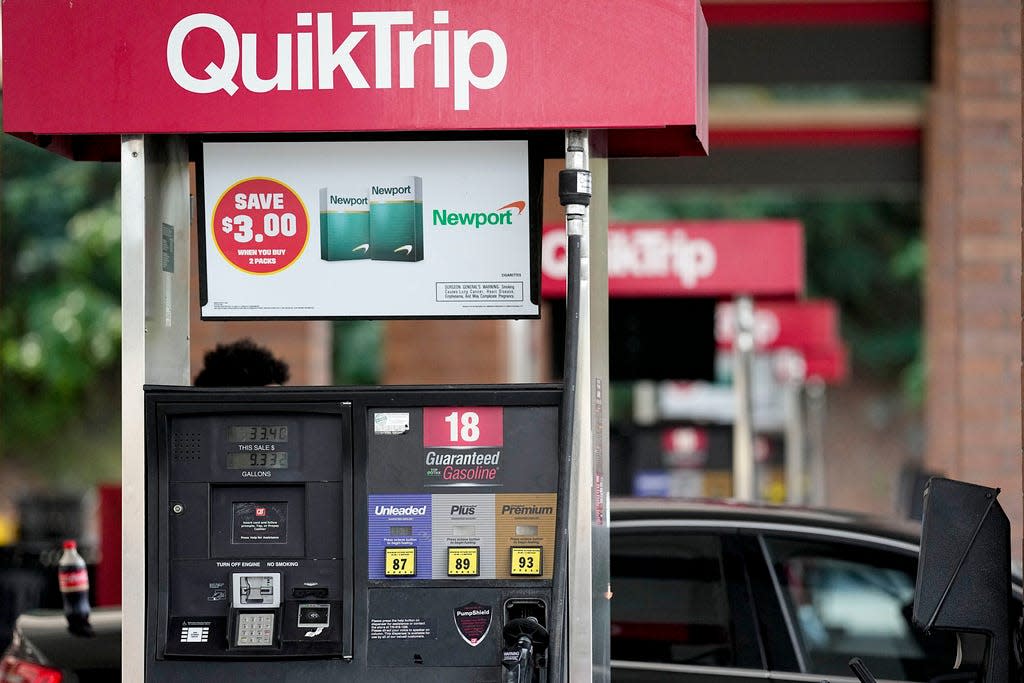 FILE - A person pumps gas on Sept. 12, 2023, in Marietta, Ga. Georgia's governor Brian Kemp on Friday, Oct. 6, 2023, continued his rollback of state taxes on gasoline and diesel fuel through Nov. 11, 2023. (AP Photo/Mike Stewart)