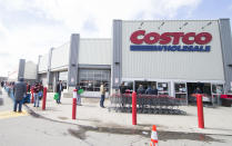 Customers line up with a social distance to enter a Costco warehouse store in Mississauga, Ont., on March 20, 2020. Canadian Prime Minister Justin Trudeau announced new measures Friday morning to mobilize manufacturers to quickly produce vital life-saving medical supplies against the COVID-19 pandemic in the country. As of Friday noon, Canada has confirmed 924 COVID-19 cases and 13 people died of the coronavirus. (Photo by Zou Zheng/Xinhua via Getty)